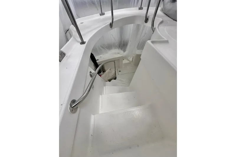 Ohana Yacht Photos Pics Staircase on 1999 Mainship 390 Trawler with stainless steel handrails.