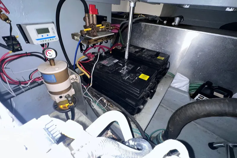 Ohana Yacht Photos Pics Engine room of 1999 Mainship 390 Trawler with batteries and wiring.