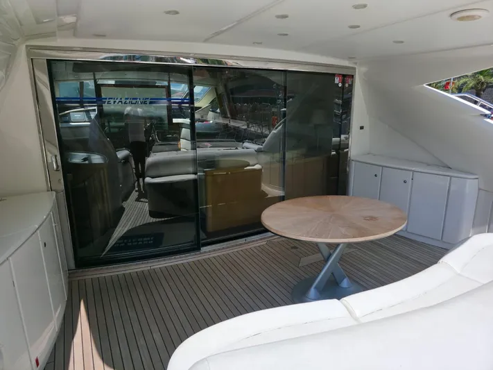 Evazione Yacht Photos Pics Luxurious 2005 Pershing 67 yacht interior with sleek design and modern furnishings.