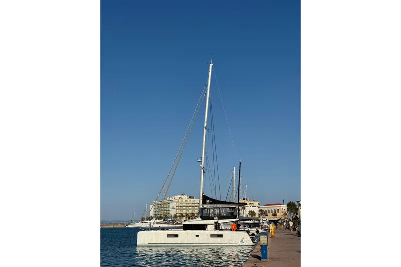 Chicago Yacht Photos Pics 2020 Lagoon 52 F catamaran docked at a sunny marina with clear blue skies.
