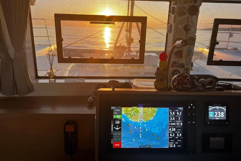 Chicago Yacht Photos Pics Cockpit view of 2020 Lagoon 52 F catamaran at sunset with navigation screens.
