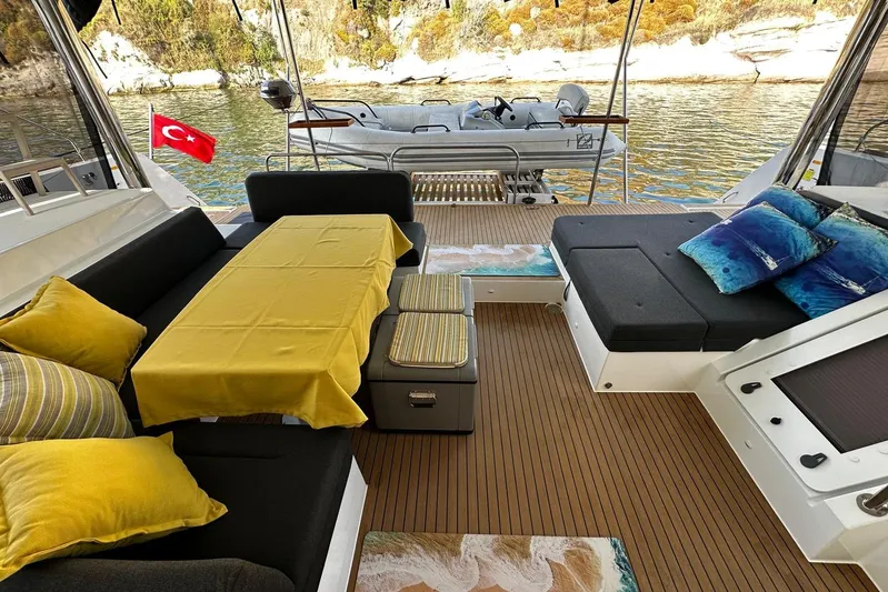 Chicago Yacht Photos Pics Luxurious Lagoon 52 F yacht interior with yellow accents, Turkish flag, and scenic water view.