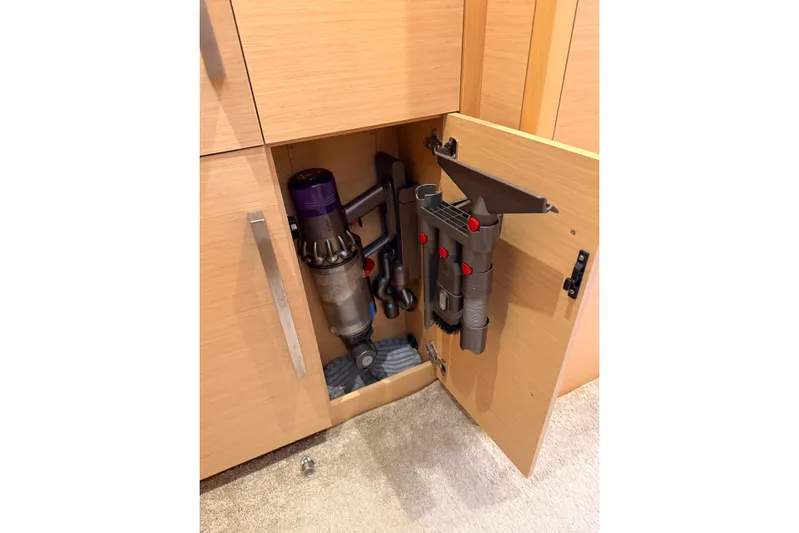 Chicago Yacht Photos Pics Vacuum cleaner stored in a wooden cabinet on a 2020 Lagoon 52 F yacht.