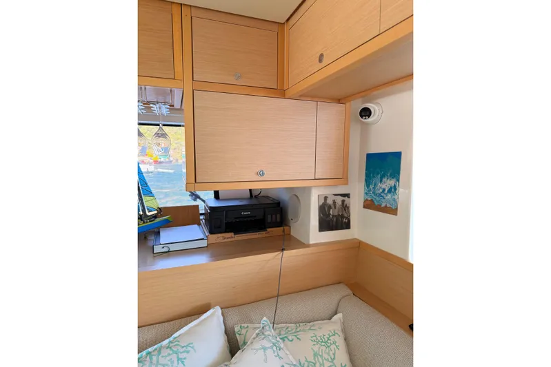 Chicago Yacht Photos Pics Interior of 2020 Lagoon 52 F yacht with wooden cabinets and cozy seating area.