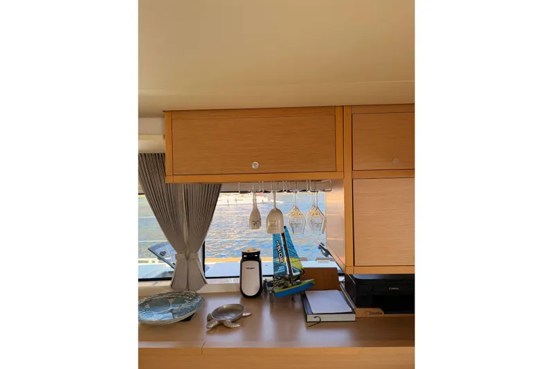 Chicago Yacht Photos Pics Interior of 2020 Lagoon 52 F yacht with wooden cabinets and ocean view.