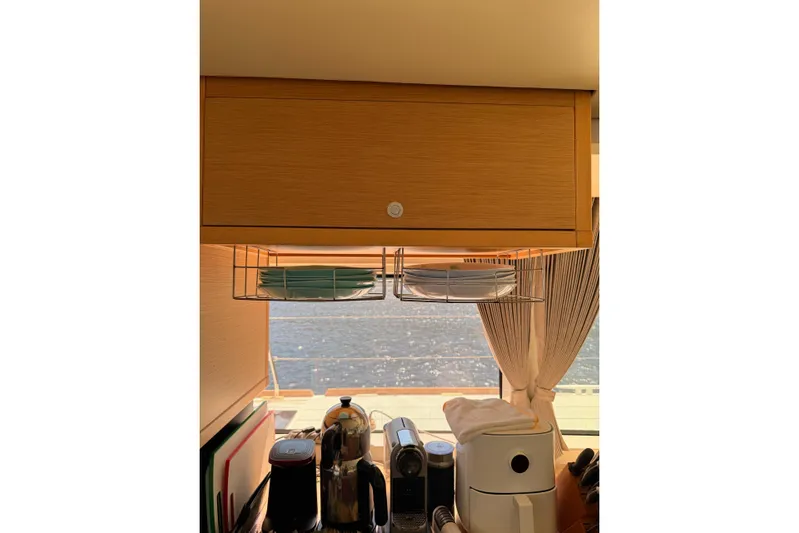 Chicago Yacht Photos Pics Modern kitchen interior of 2020 Lagoon 52 F yacht with appliances and ocean view.