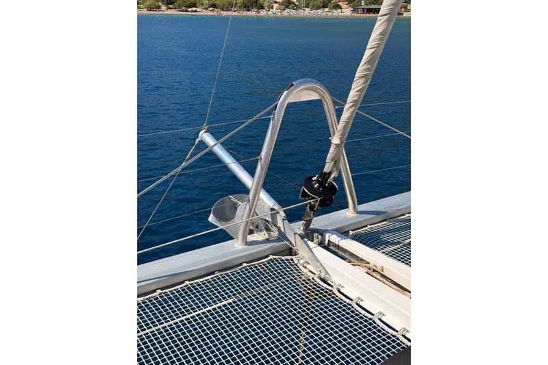 Chicago Yacht Photos Pics Bow of 2020 Lagoon 52 F catamaran with netting and anchor, on calm blue water.