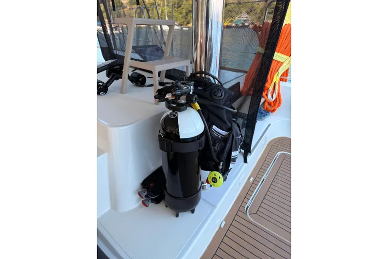Chicago Yacht Photos Pics Scuba gear on 2020 Lagoon 52 F yacht deck, featuring diving equipment and safety ropes.