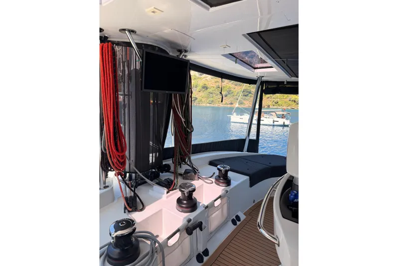 Chicago Yacht Photos Pics Interior view of 2020 Lagoon 52 F yacht with ropes and winches, overlooking serene waters.