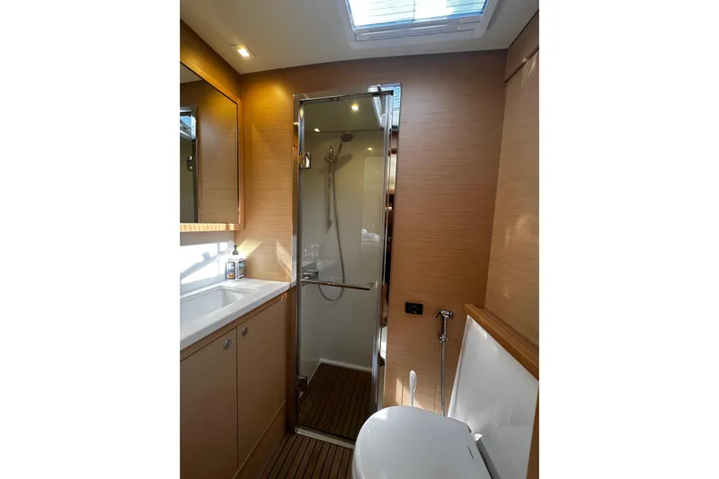 Chicago Yacht Photos Pics Modern bathroom interior of 2020 Lagoon 52 F yacht with shower and skylight.