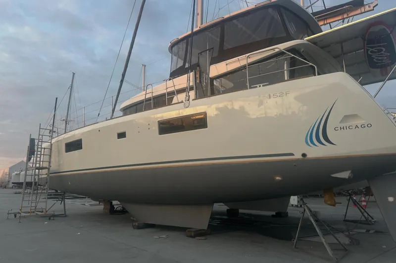 Chicago Yacht Photos Pics 2020 Lagoon 52 F catamaran on dry dock, Chicago branding visible.