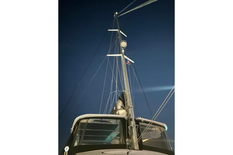 Chicago Yacht Photos Pics Mast of 2020 Lagoon 52 F sailboat against a starry night sky.