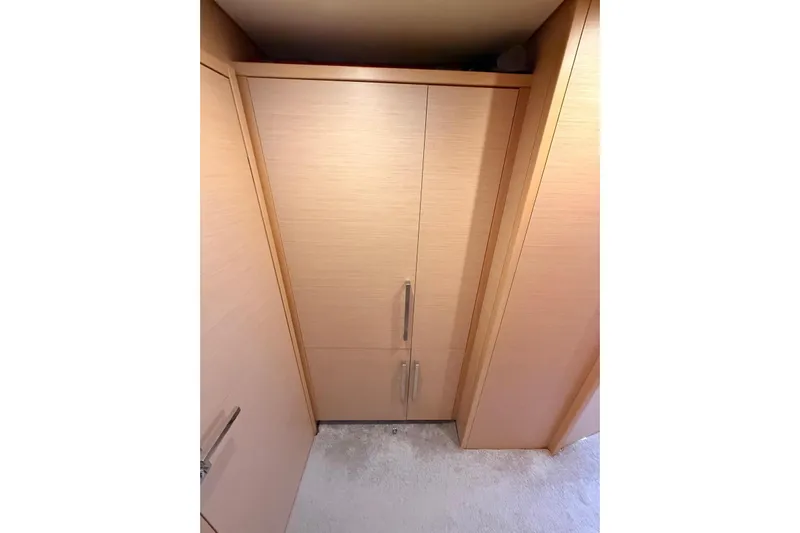 Chicago Yacht Photos Pics Interior view of a 2020 Lagoon 52 F yacht, featuring a wooden cabinet with sleek handles.