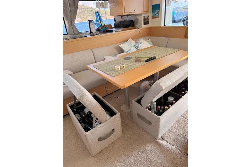 Chicago Yacht Photos Pics Interior of 2020 Lagoon 52 F yacht with storage benches and dining table.