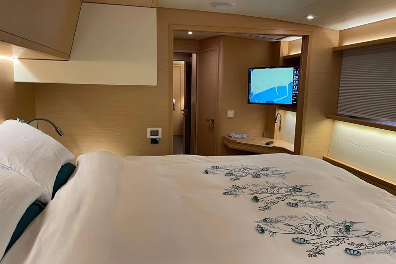 Chicago Yacht Photos Pics Luxurious cabin interior of 2020 Lagoon 52 F yacht with elegant bedding and modern amenities.