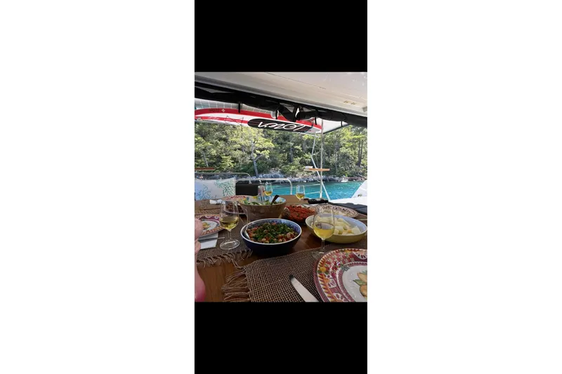 Chicago Yacht Photos Pics Dining setup on Lagoon 52 F yacht, 2020, with scenic ocean view.