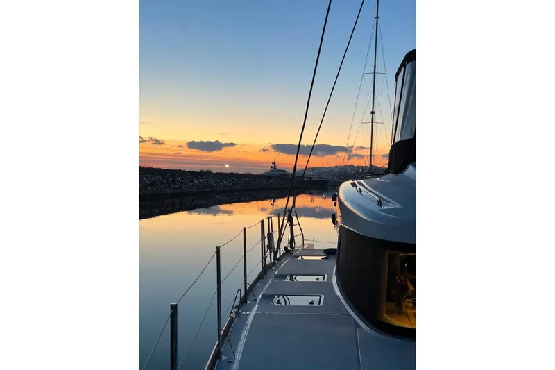 Chicago Yacht Photos Pics Lagoon 52 F yacht at sunset, 2020 model, docked in serene waters.