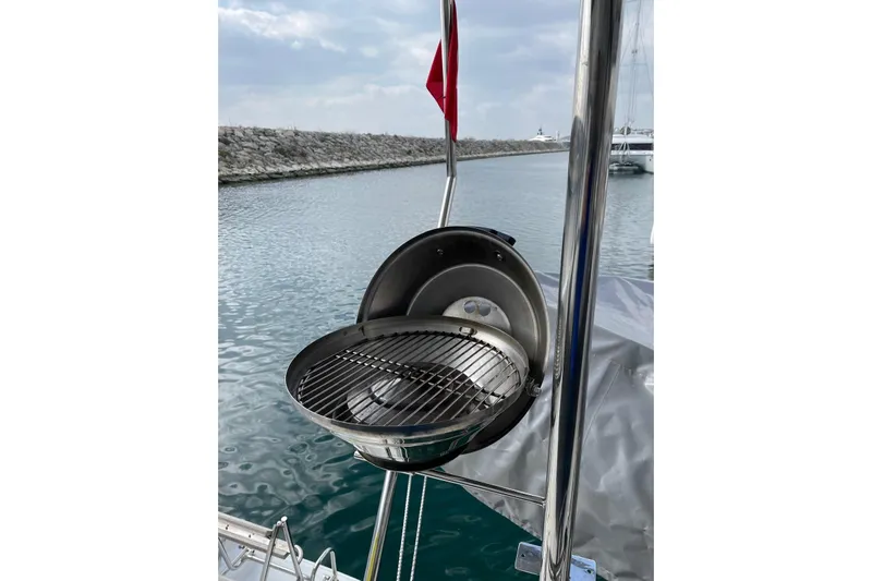 Chicago Yacht Photos Pics Outdoor grill on a 2020 Lagoon 52 F yacht, docked by a calm waterfront.