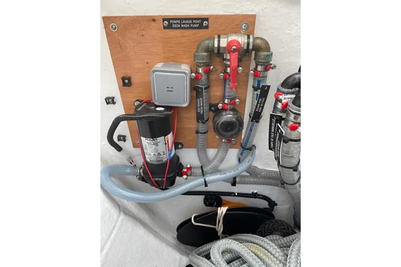 Chicago Yacht Photos Pics Deck wash pump system on 2020 Lagoon 52 F yacht, featuring hoses and valves.
