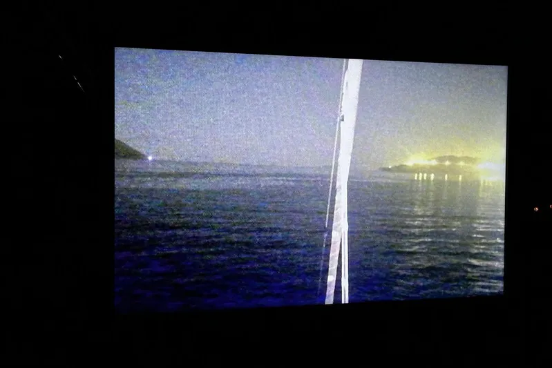 Chicago Yacht Photos Pics Nighttime view from Lagoon 52 F yacht, 2020 model, overlooking calm sea and distant lights.