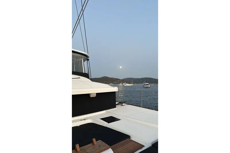 Chicago Yacht Photos Pics Lagoon 52 F yacht deck with scenic ocean view at sunset, 2020 model.