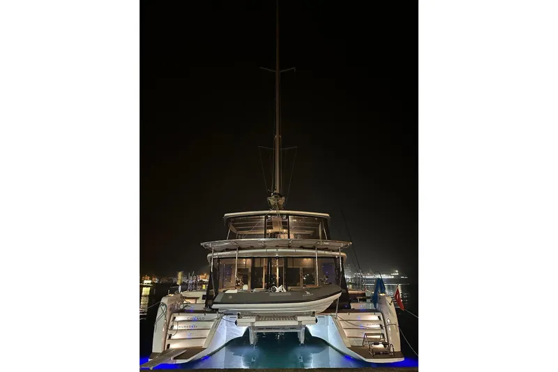Chicago Yacht Photos Pics 2020 Lagoon 52 F catamaran docked at night with illuminated deck.
