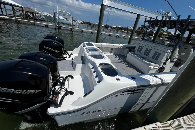 Reel Deployment Yacht Photos Pics 2022 Invincible 46 Catamaran with Mercury engines docked at marina.