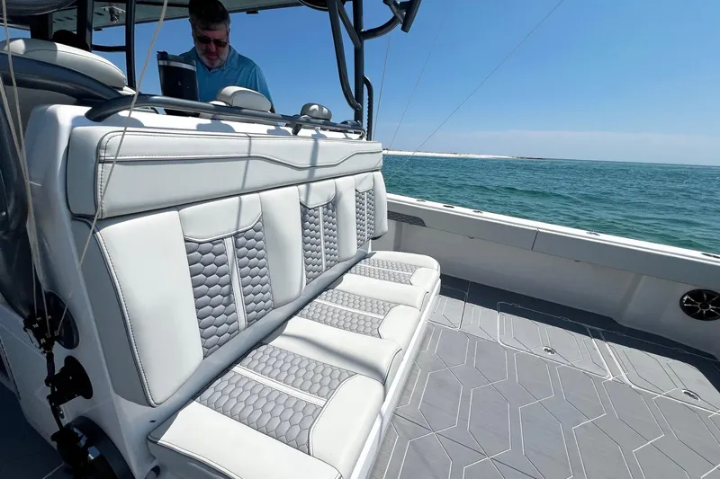 Reel Deployment Yacht Photos Pics 2022 Invincible 46 Catamaran with luxurious seating, cruising on open water.