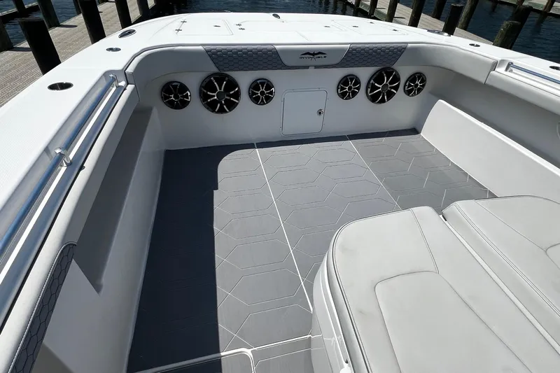 Reel Deployment Yacht Photos Pics 2022 Invincible 46 Catamaran interior with sleek seating and modern speaker system.