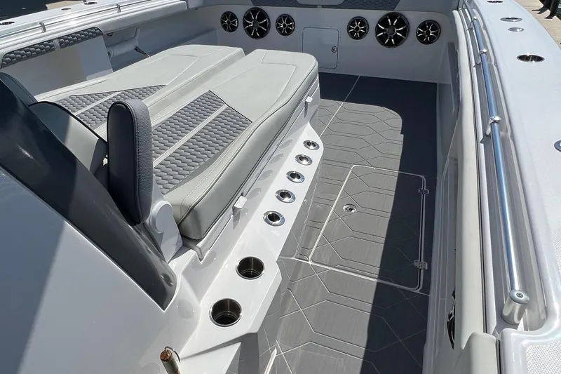 Reel Deployment Yacht Photos Pics 2022 Invincible 46 Catamaran interior with cushioned seating and sleek design.