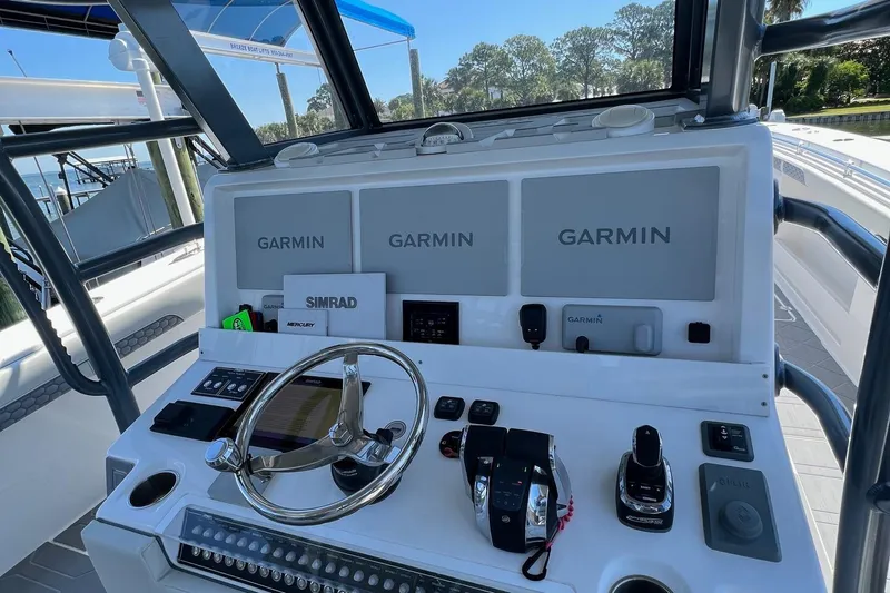 Reel Deployment Yacht Photos Pics Helm of 2022 Invincible 46 Catamaran with Garmin navigation displays and controls.