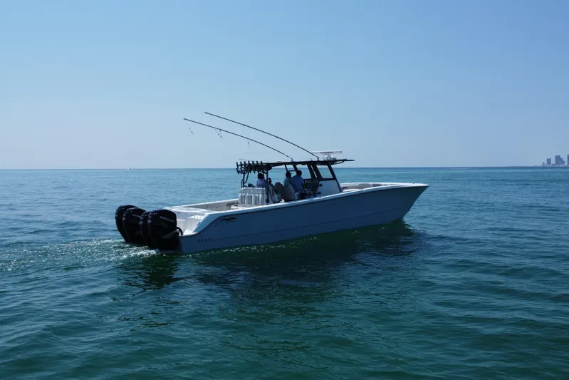 Reel Deployment Yacht Photos Pics 2022 Invincible 46 Catamaran cruising on open water under clear blue sky.