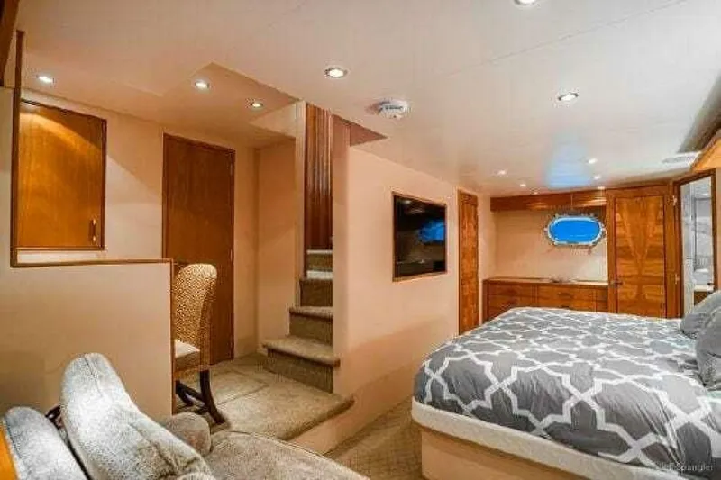Desperado Yacht Photos Pics Luxurious bedroom interior of 2008 Hatteras 77 Enclosed Bridge yacht with modern decor.