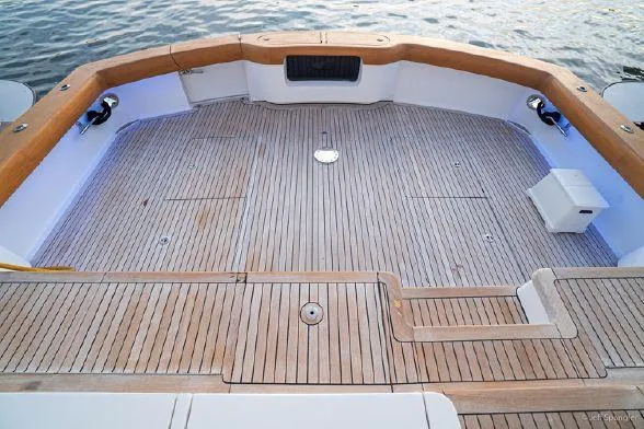 Desperado Yacht Photos Pics Spacious deck of 2008 Hatteras 77 Enclosed Bridge yacht with wooden flooring.