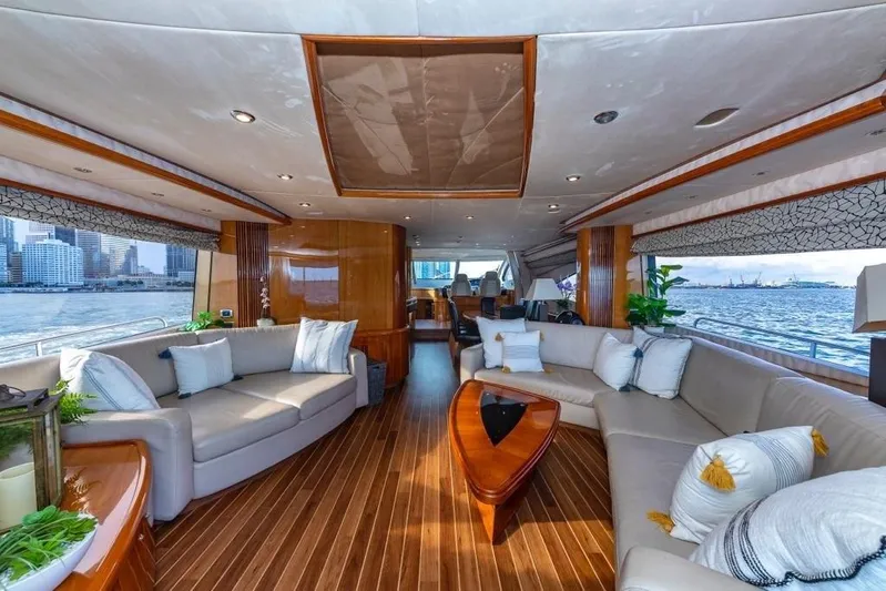 Alaina Yacht Photos Pics Luxurious interior of 2003 Sunseeker 82 Yacht with elegant seating and ocean view.