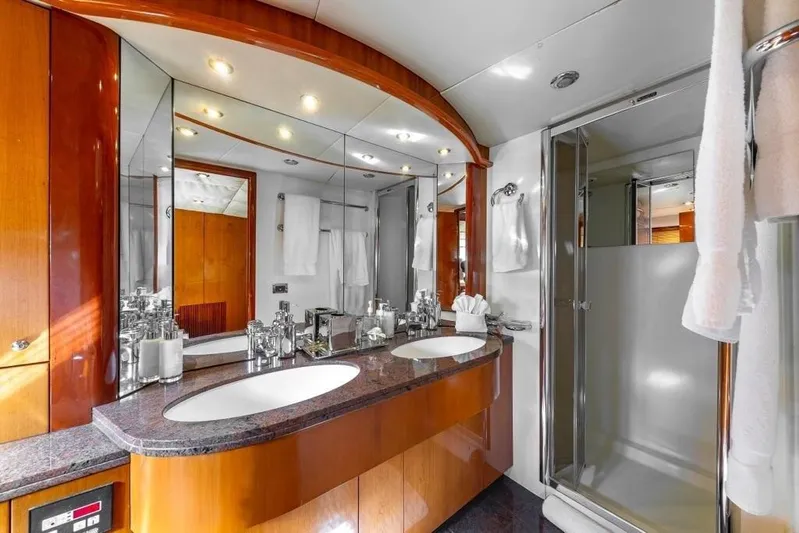 Alaina Yacht Photos Pics Luxurious bathroom on 2003 Sunseeker 82 Yacht with double sinks and modern shower.