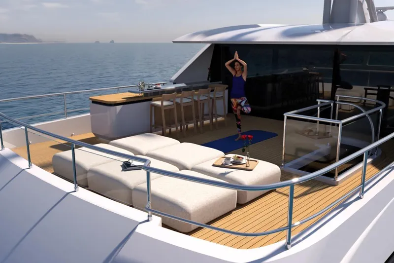 Presence Yacht Photos Pics Luxury yacht deck with yoga area, bar, and ocean view on Cantiere Delle Marche 130.37, 2026 model.