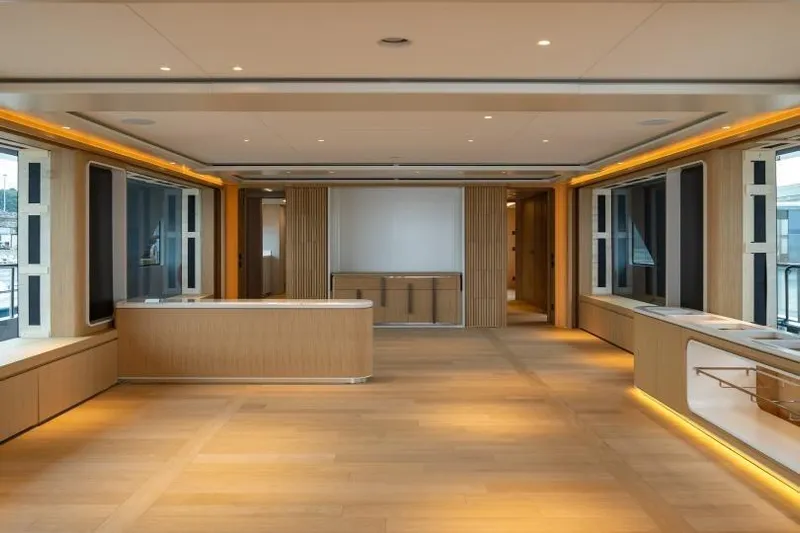Presence Yacht Photos Pics Luxurious interior of 2026 Cantiere Delle Marche 130.37 yacht with modern wood finishes.