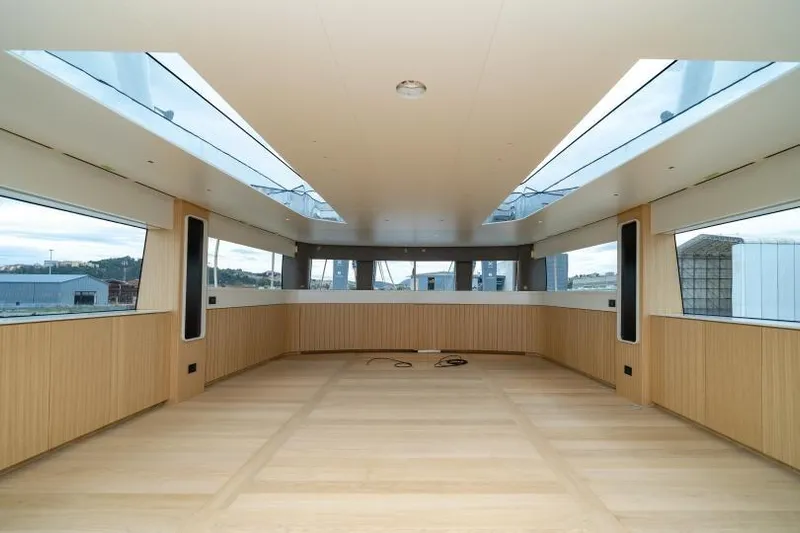 Presence Yacht Photos Pics Spacious interior of 2026 Cantiere Delle Marche 130.37 yacht with panoramic windows.