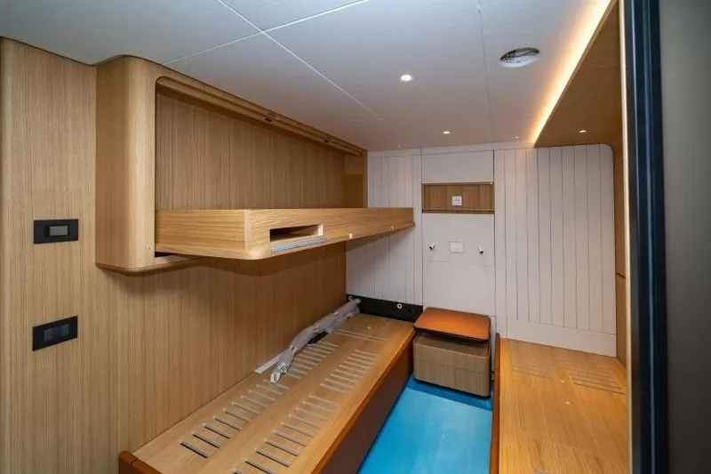 Presence Yacht Photos Pics Modern interior of 2026 Cantiere Delle Marche 130.37 yacht cabin with wooden finishes.