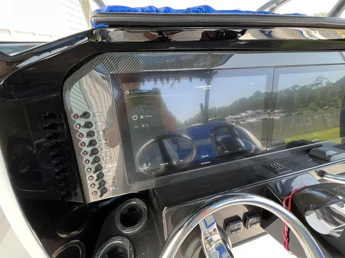  Yacht Photos Pics 2020 Nor-Tech 392 Super Fish dashboard with touchscreen display and controls.