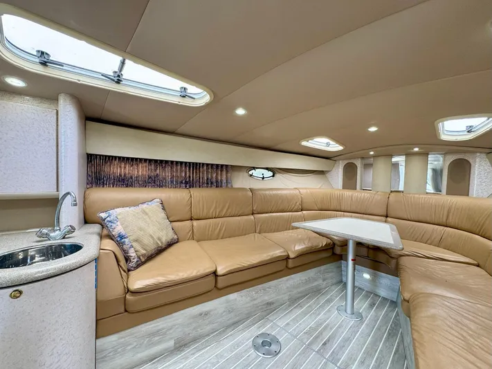 Tony Montana Yacht Photos Pics Luxurious interior of a 1999 Formula 400 Super Sport yacht with leather seating and modern amenities.