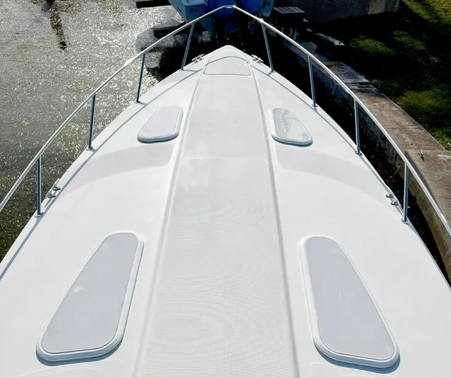 Tony Montana Yacht Photos Pics 1999 Formula 400 Super Sport boat deck with sleek design and railing.