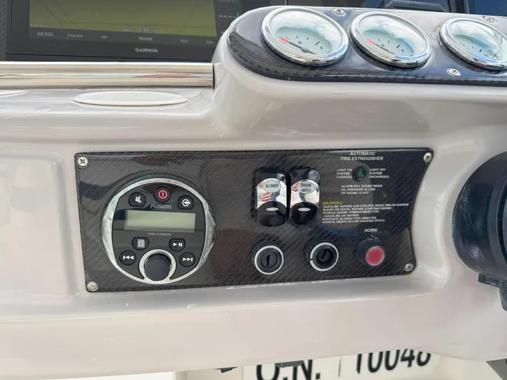 Tony Montana Yacht Photos Pics Control panel of a 1999 Formula 400 Super Sport boat with gauges and switches.