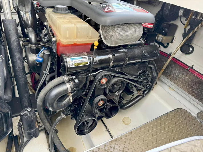 Tony Montana Yacht Photos Pics Engine compartment of a 1999 Formula 400 Super Sport boat, featuring a MerCruiser engine.