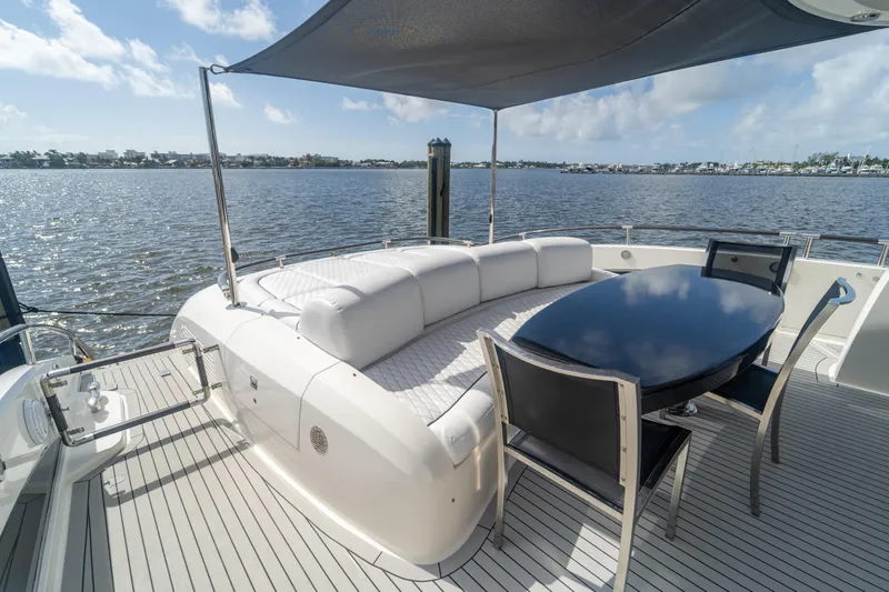 The Office Yacht Photos Pics Luxurious 2009 Lazzara LSX 75 yacht deck with elegant seating and dining area.
