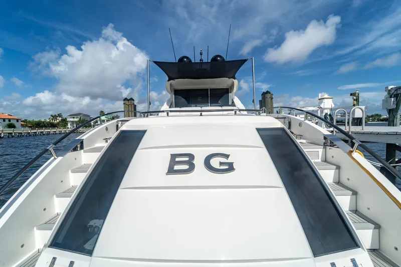 The Office Yacht Photos Pics 2009 Lazzara LSX 75 yacht docked, featuring sleek design and spacious deck.