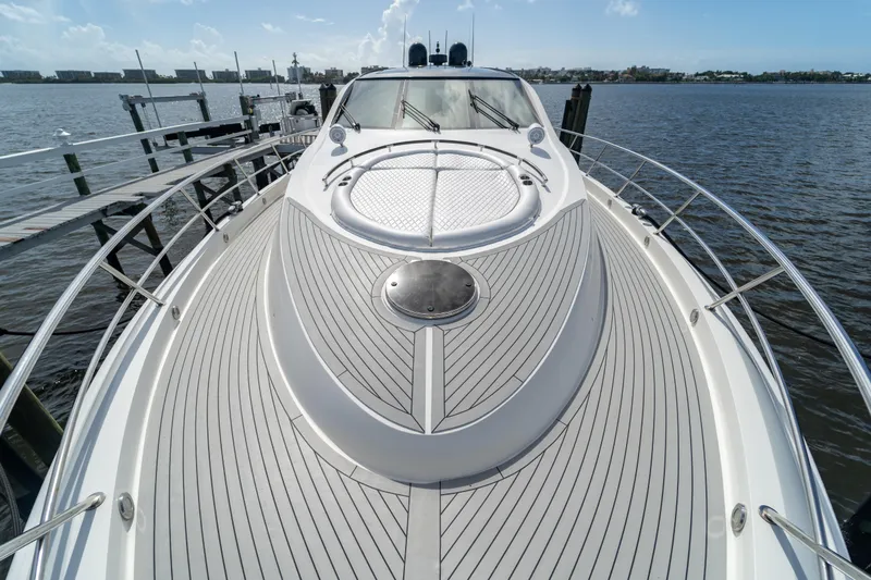 The Office Yacht Photos Pics 2009 Lazzara LSX 75 yacht deck with sleek design, docked by the water.