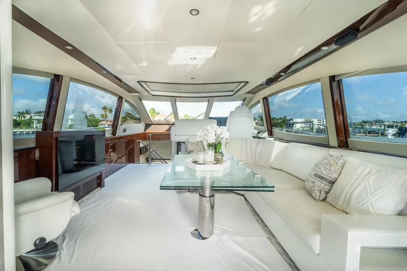 The Office Yacht Photos Pics Luxurious interior of 2009 Lazzara LSX 75 yacht with elegant seating and panoramic windows.
