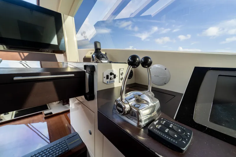 The Office Yacht Photos Pics Control panel of a 2009 Lazzara LSX 75 yacht with modern navigation equipment.